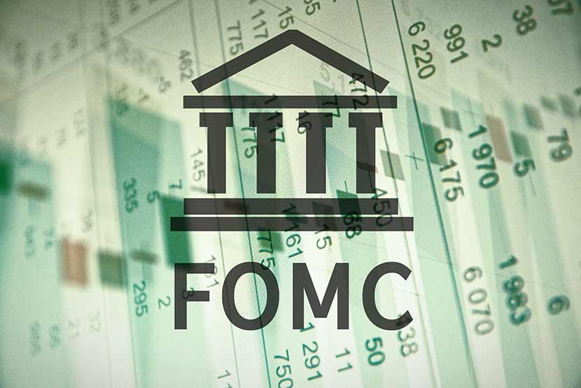 Federal Open Market Committee abbreviation against green background of numbers