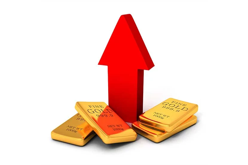 Four 100 gram gold bars at the base of a red arrow pointing upwards