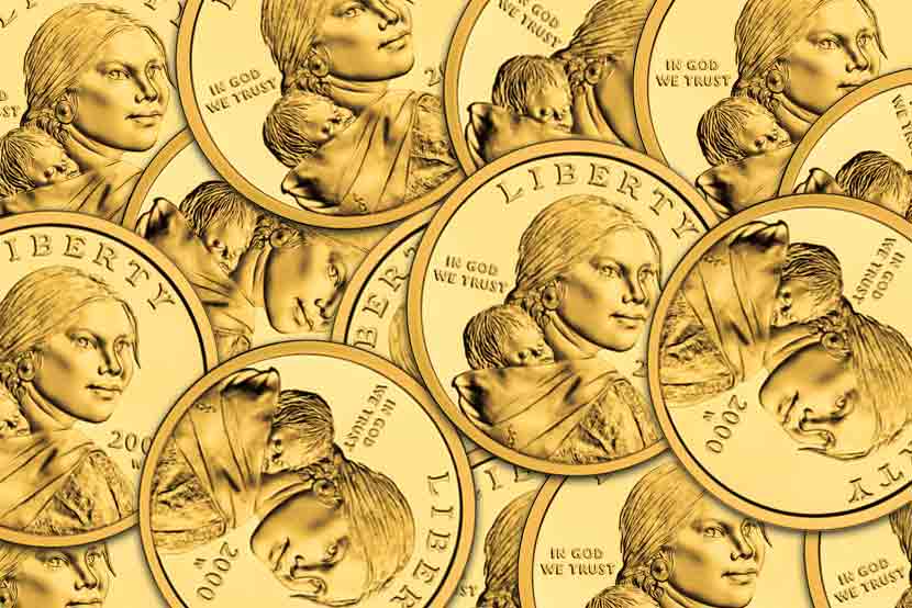 Dozens of Sacajawea gold dollar coins, face up