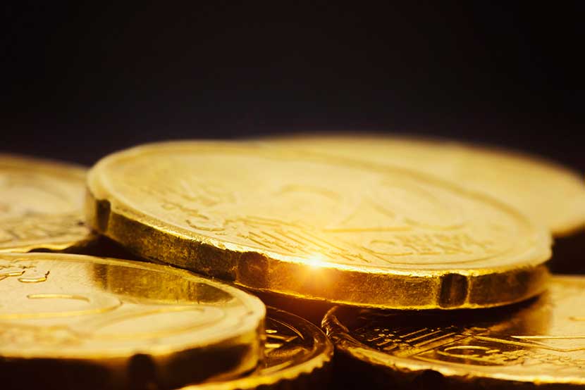 gold-coins Gold coins reflecting light
