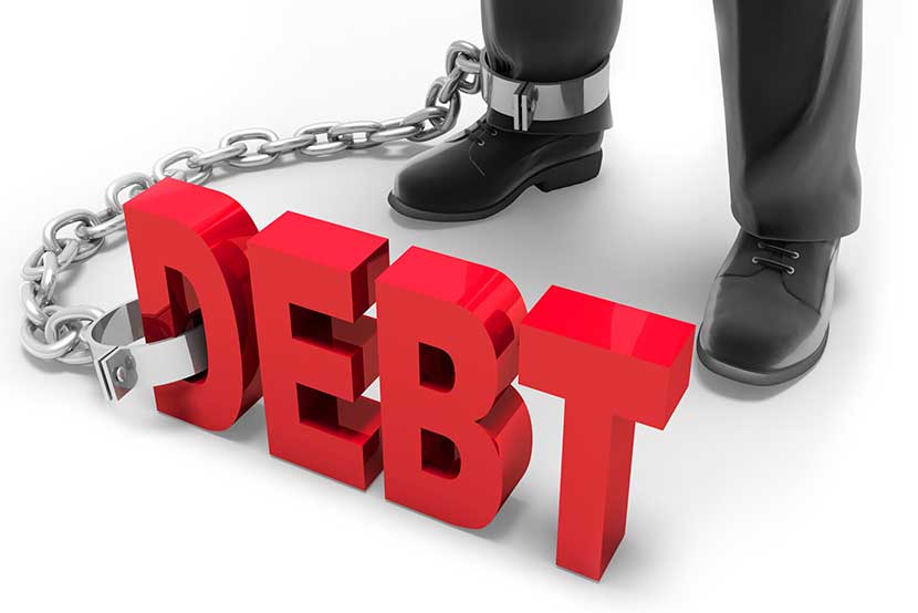 Debt chained to the ankle of business professional