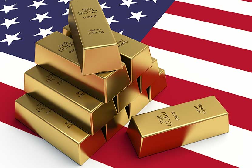1000 gram gold bars on American flag