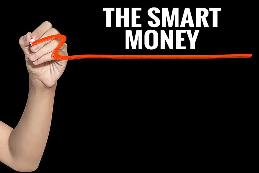 the-smart-money Writing with red pen on board that reads Smart Money
