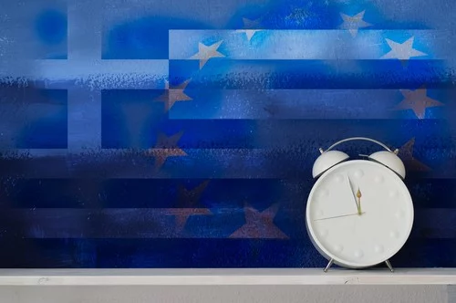 Greece Clock – Original Greek flag juxtaposed over European Union flag with white retro clock sitting in front, moments away from unrest