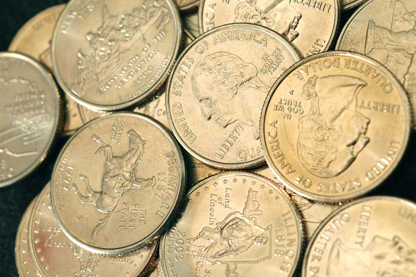 state-quarters Pile of state quarters, with Illinois state quarter and Delaware state quarter featured prominently