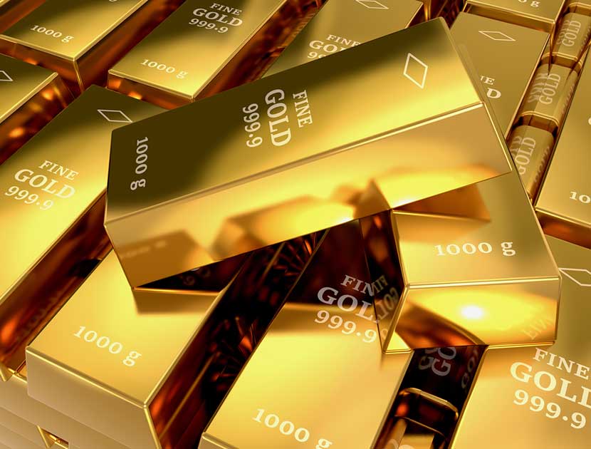 Multiple stacks of 1000 gram fine gold bars