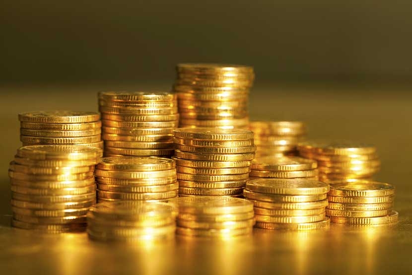 Stacks of shimmering gold coins