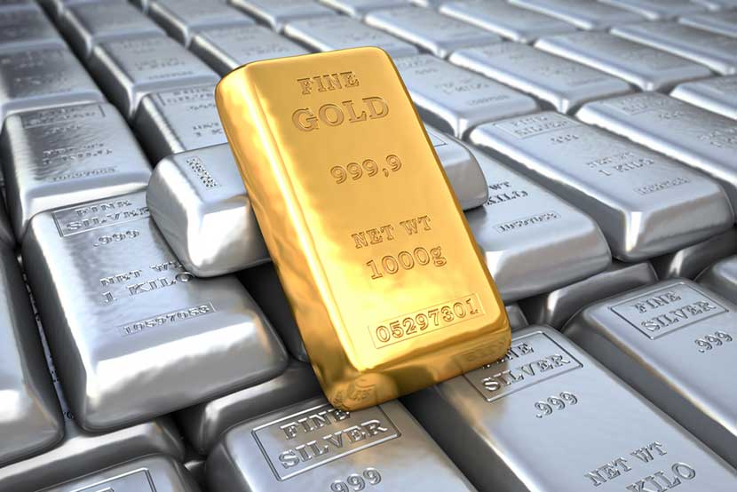 silver-gold-bar Fine gold bar leaning on rows of silver bars