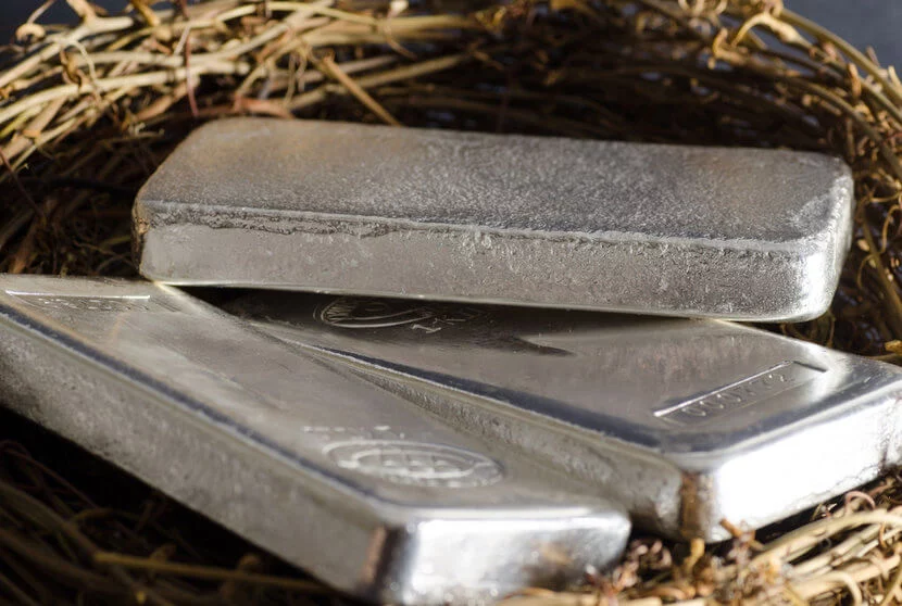 Three shiny silver bars in nest