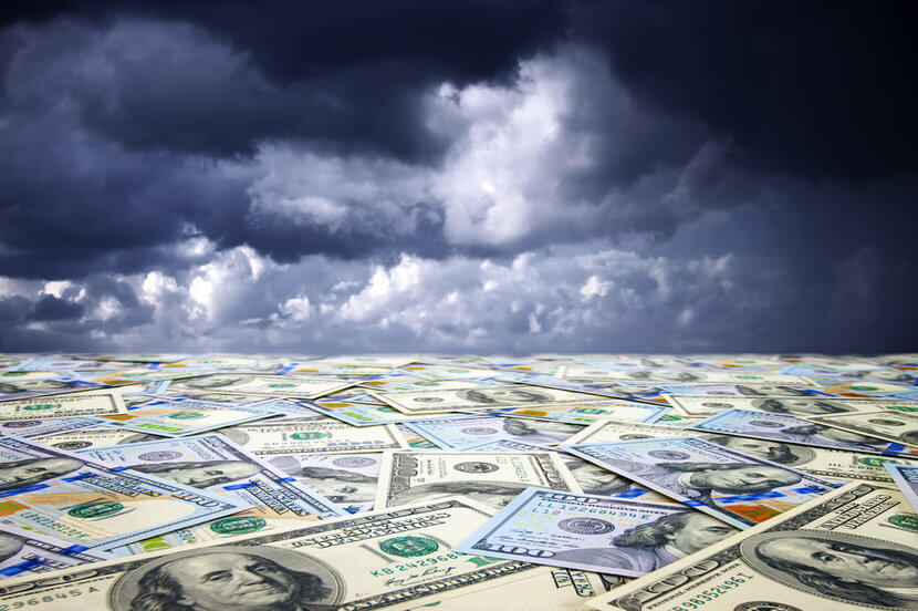 Sea of paper currency under a dark, gloomy sky