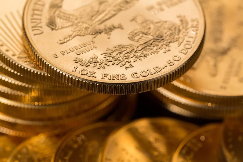 Stacks of glistening American Gold Eagle Coins