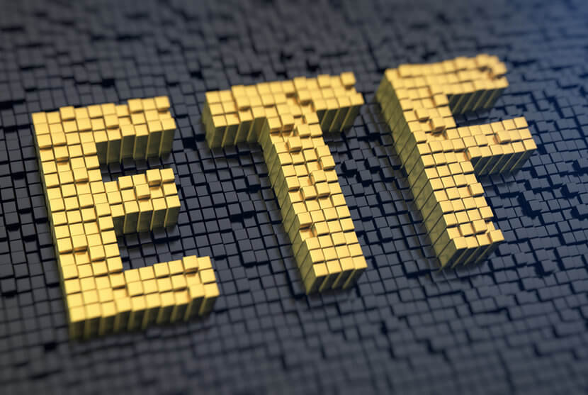 Gold blocks on black background, spelling out ETF