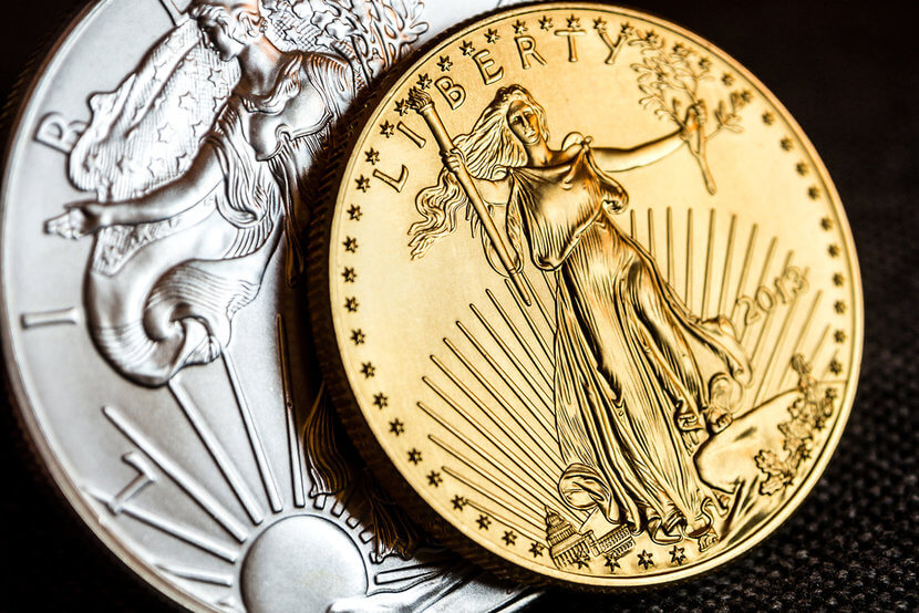 us-mint-coin-programs Silver American Eagle Coin and Gold American Eagle Coin on black background