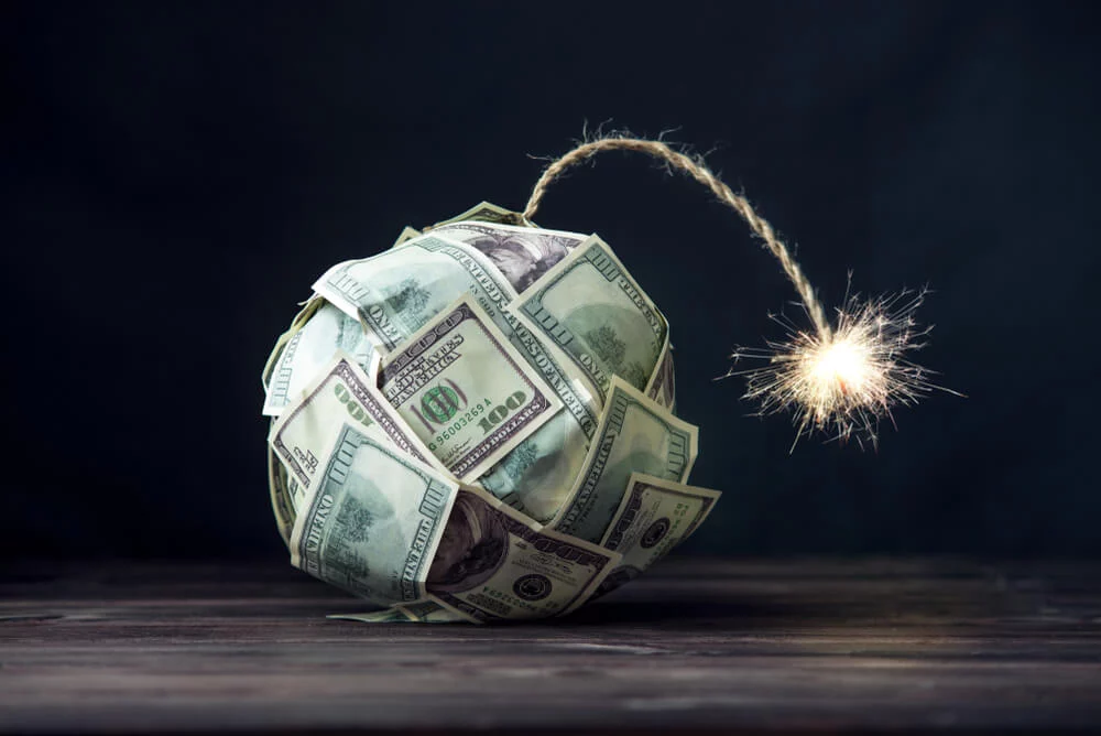Big-bomb-of-money-hundred-dollar-bills-with-a-burning-wick.-Little-time-before-the-explosion.-The-concept-of-financial-crisis