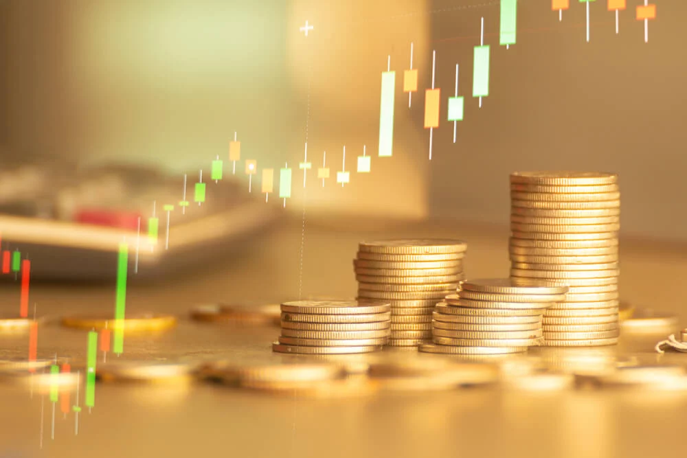 2019.01.31_Stack of money coin with forex trading graph, financial investment concept use for background Stacks of coins with forex trading graph overlayed opaquely on it