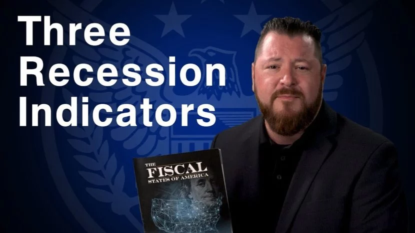 Three Recession Indicators blue background with white text that says "three recession indicators" next to Patrick Brunson holding an informational book