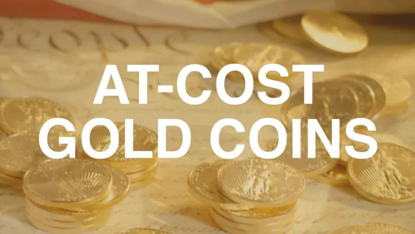 gold coins stacked on top of we the people document