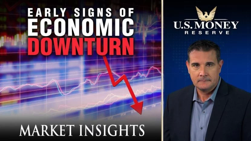 early signs of economic downturn Coy Wells presenting signs of an economic downturn with a display of a purple graph and a red negative arrow