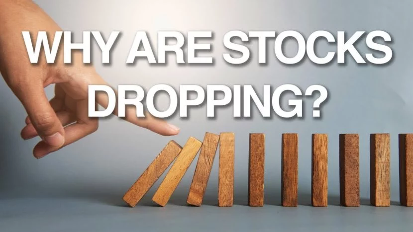 why are stocks dropping finger pushing wooden dominoes causing a domino effect representing stocks