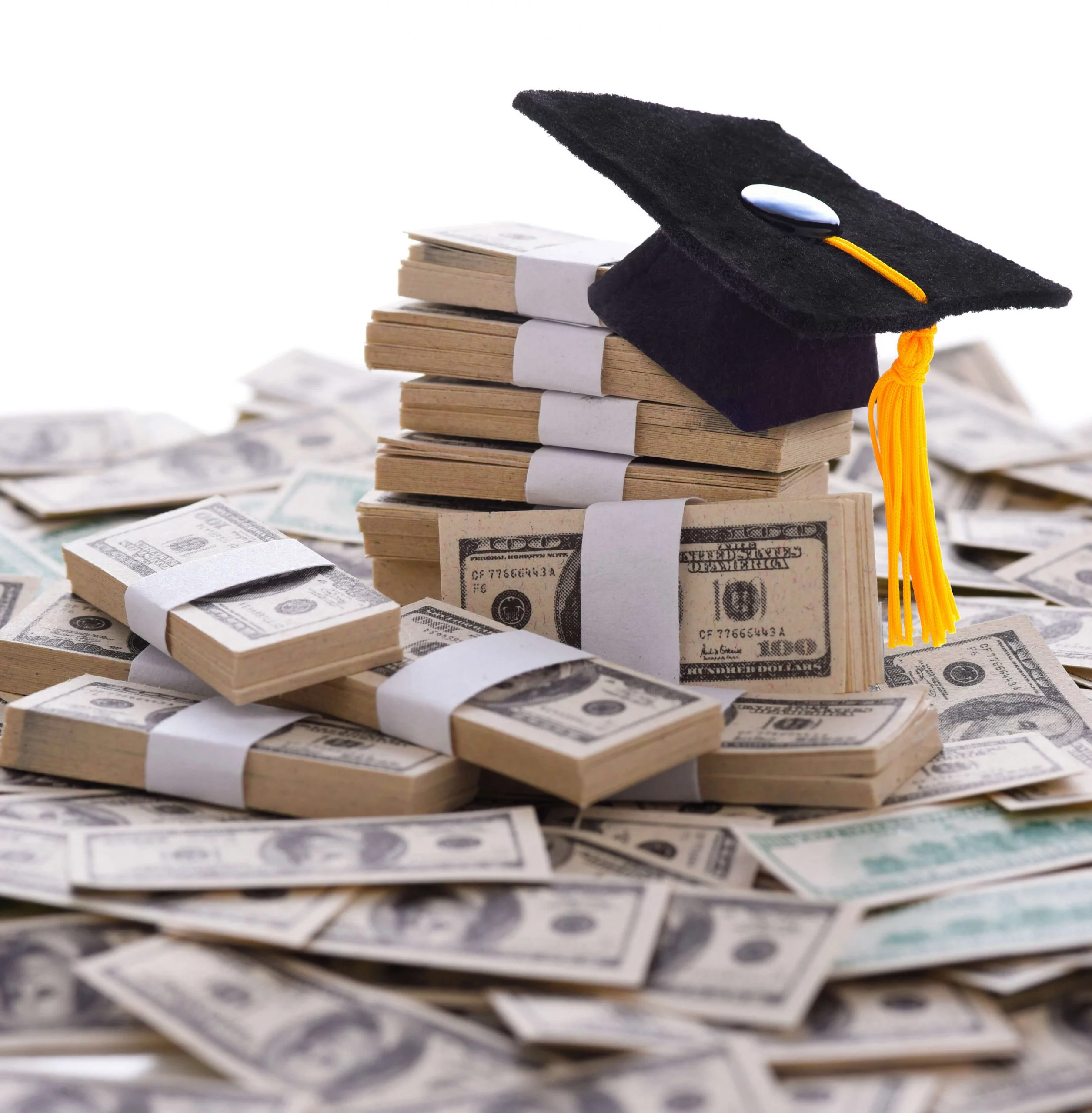 grad-cap-money_LARGE Graduation cap sitting on top of piles of money