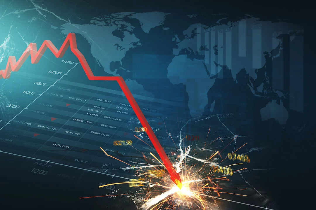 Red arrow crashing downward on stock graphic with world and downward chart in the background