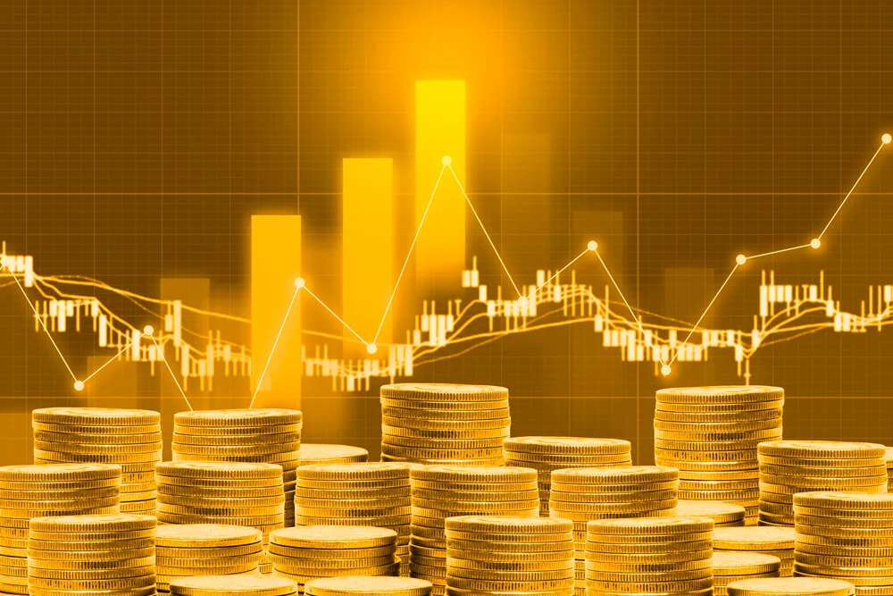 Stack of Gold Coins in front of a bar chart