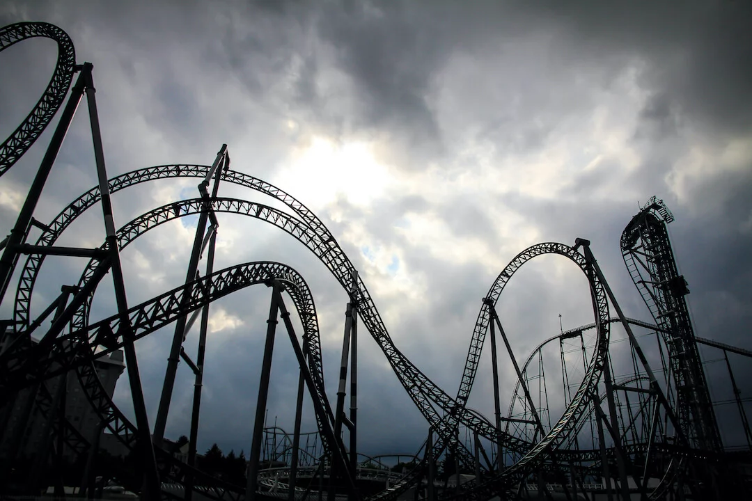 shutterstock_1026138670 Roller coaster with foreboding dark clouds in the background