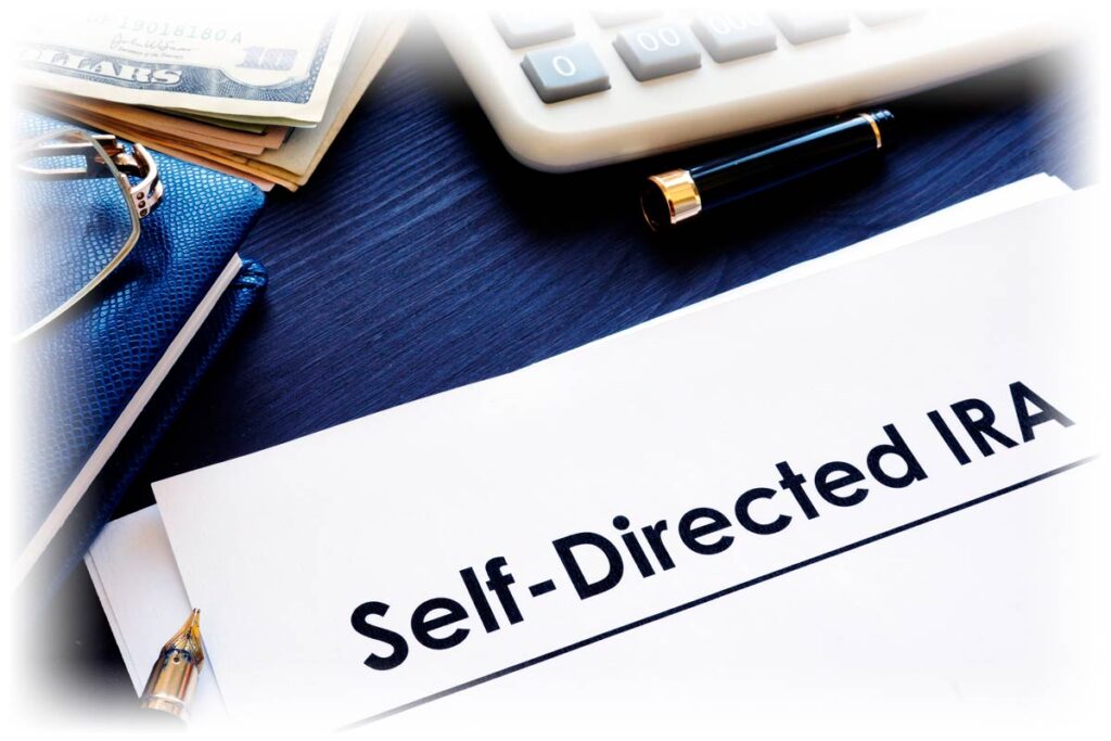 Self-Directed IRA document next to calculator and pen