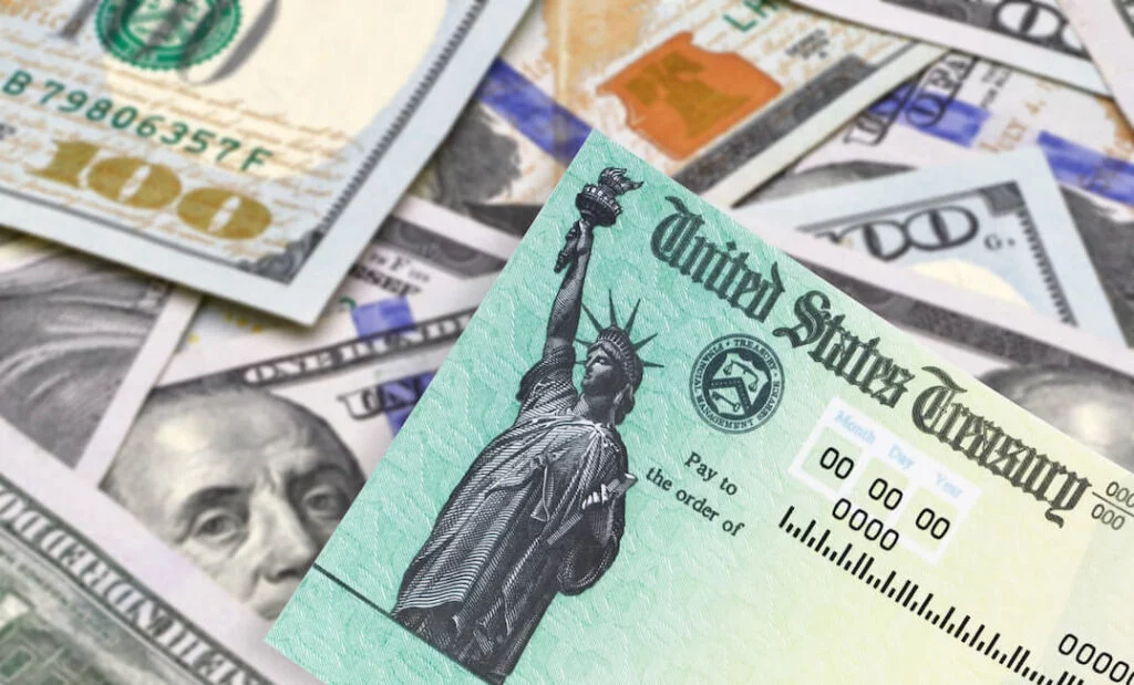 United States Treasury check, SSN card with US currency.