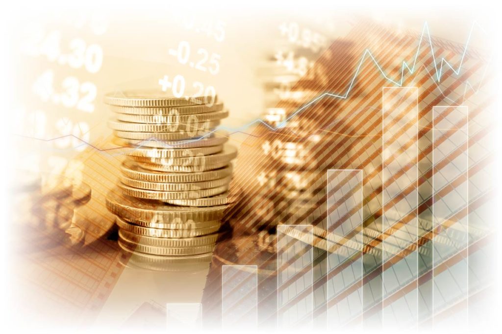 Financial and stock charts over stacks of gold coins