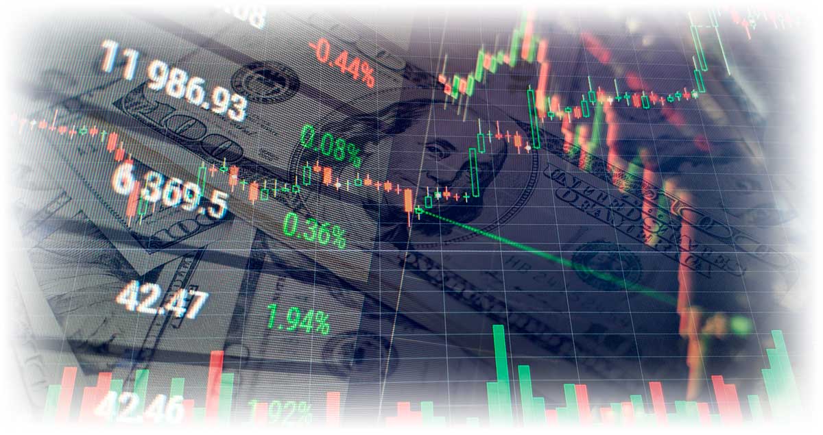 Economic data charts over pile of U.S. paper currency