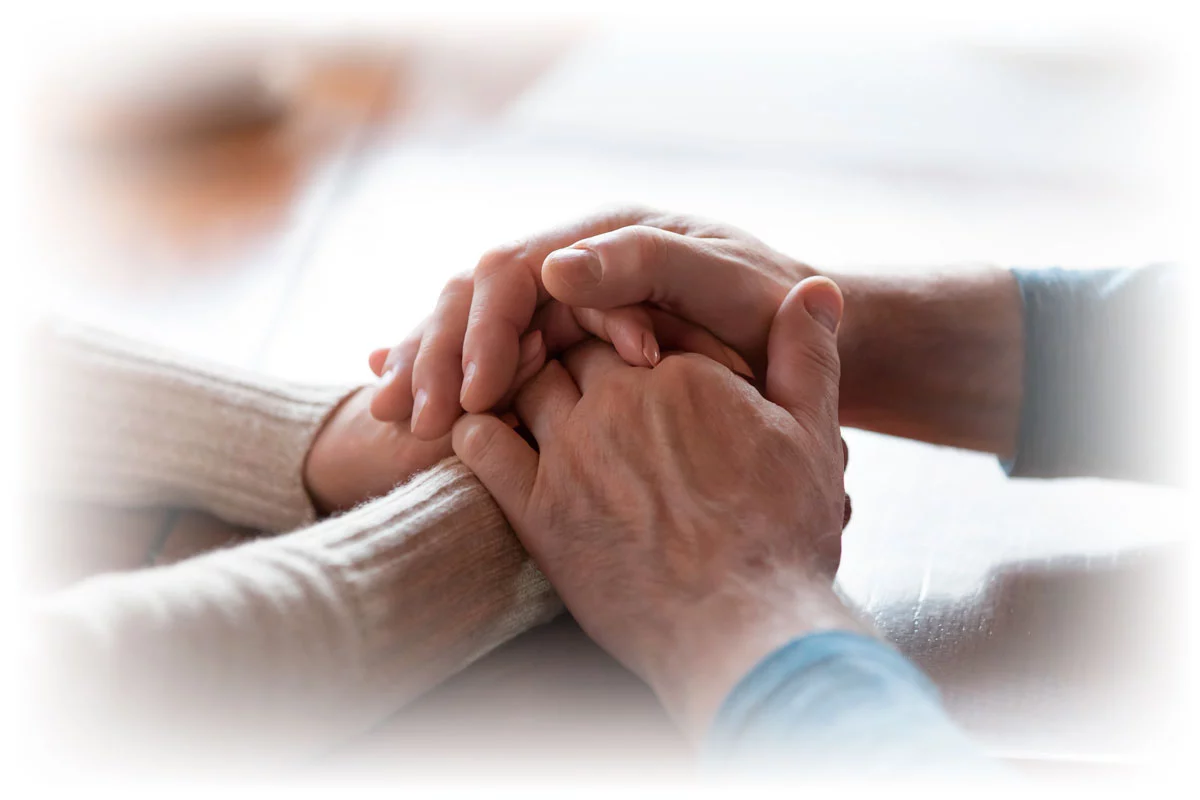Close-up of couple holding hands