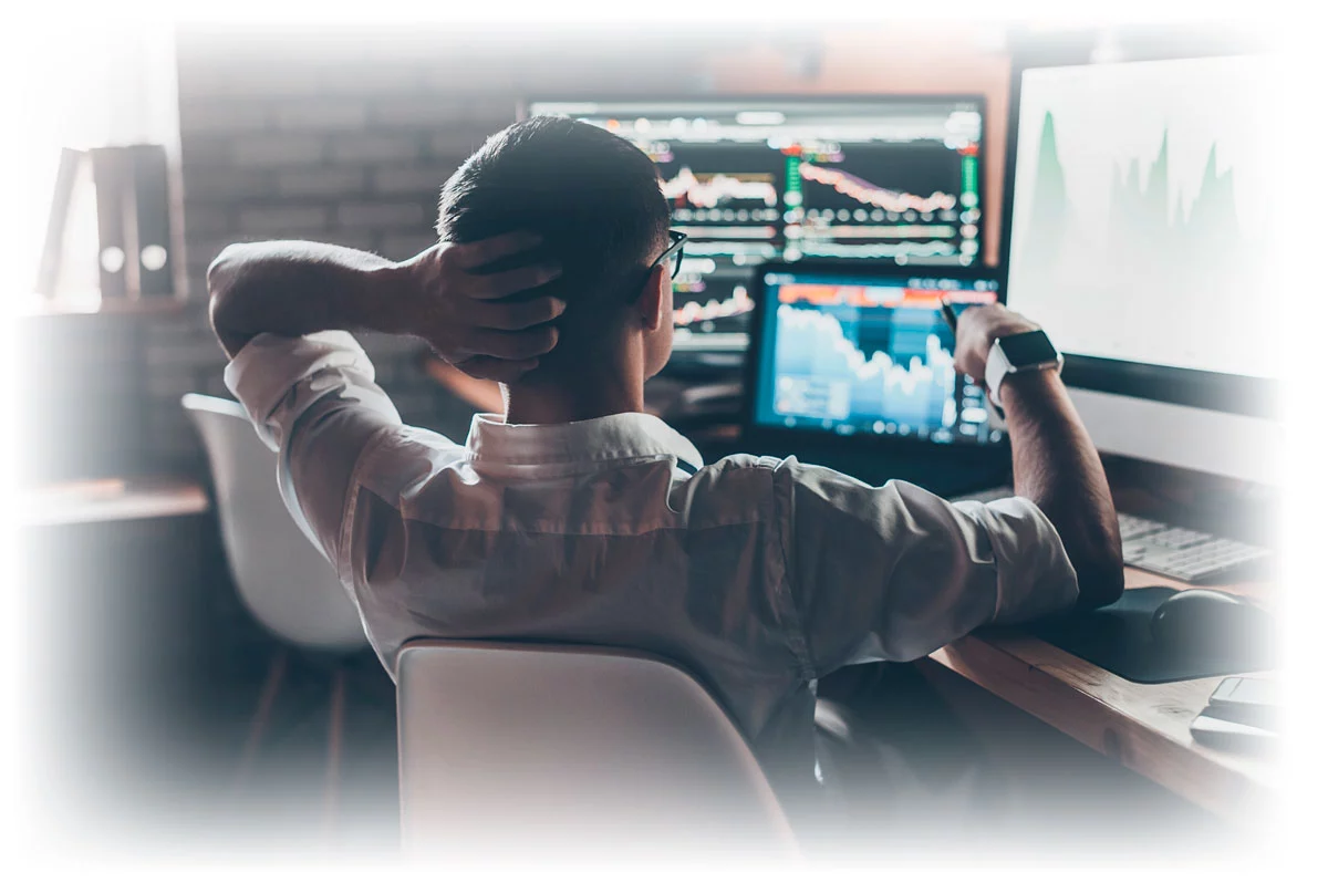 Stock trader looking at financial charts