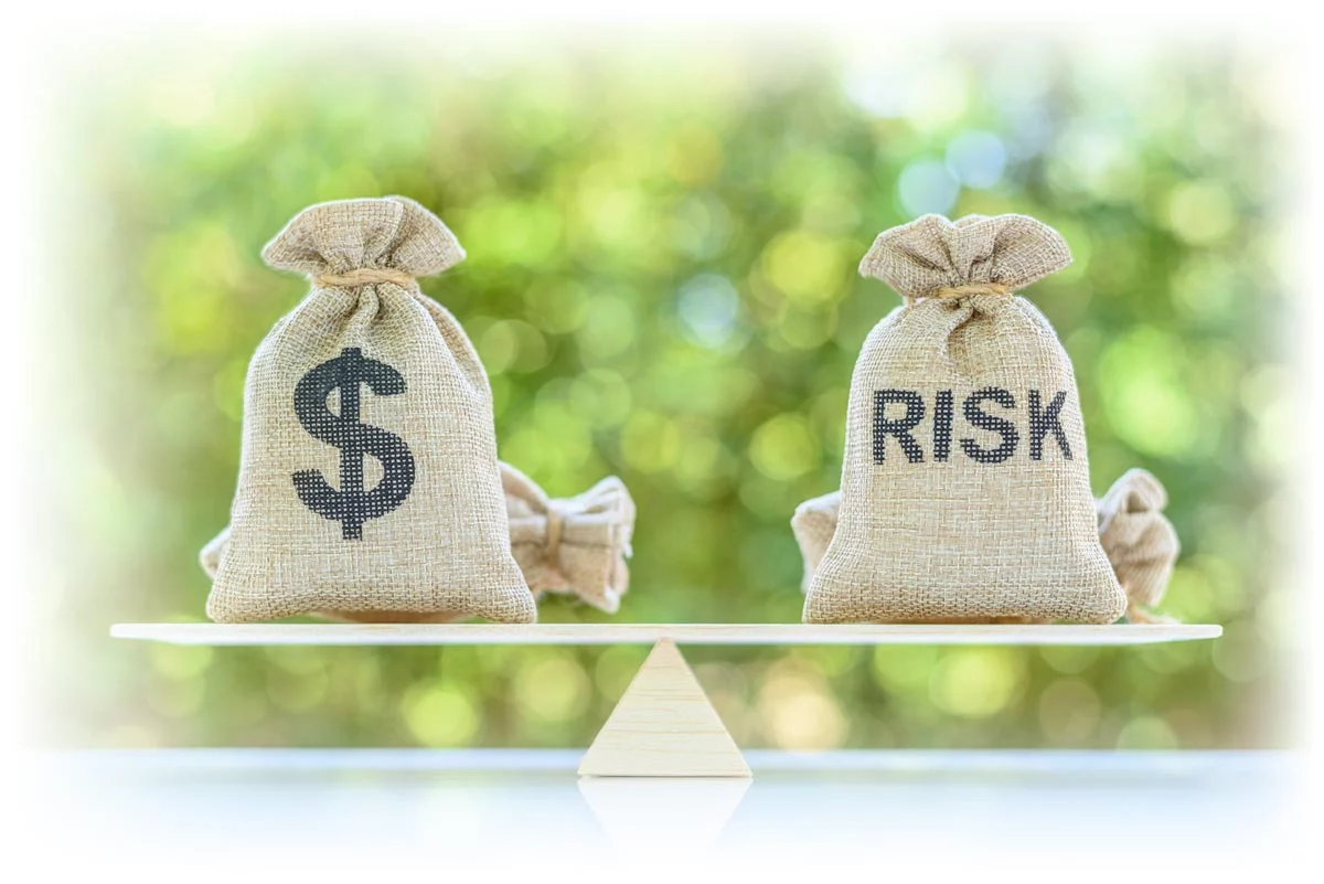 Two sacks balanced on a seesaw, one with a dollar sign and one labeled “RISK” Two sacks balanced on a seesaw, one with a dollar sign and one labeled “RISK”