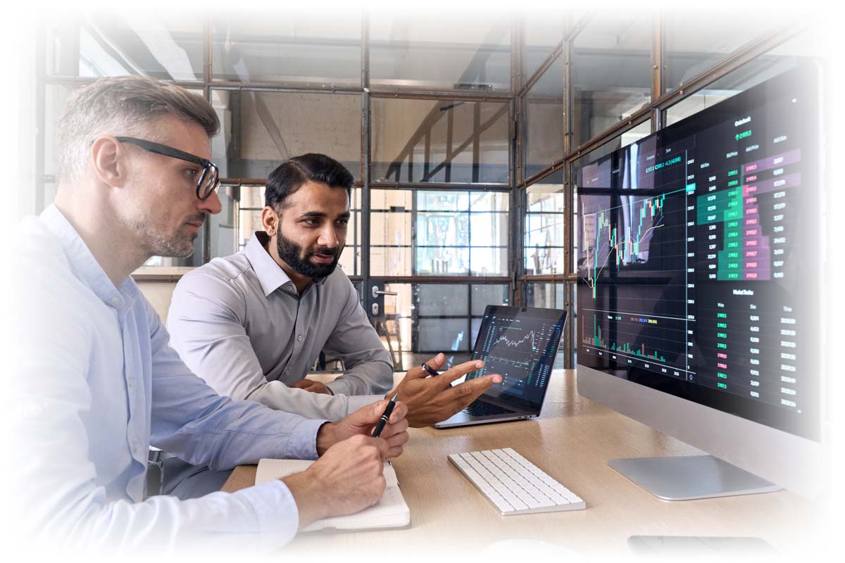 Two men comparing stock charts and data