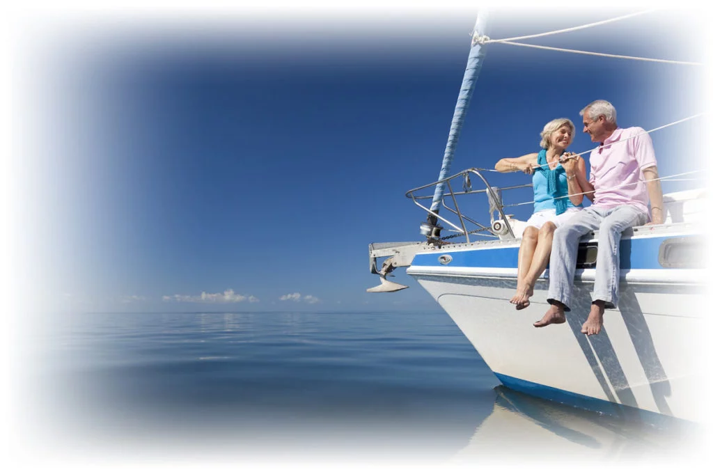 Retired couple sitting together on boat
