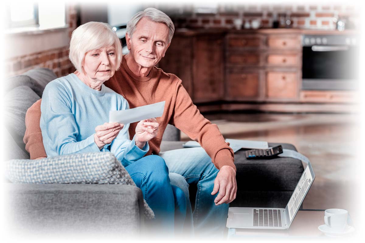 Older couple examining check