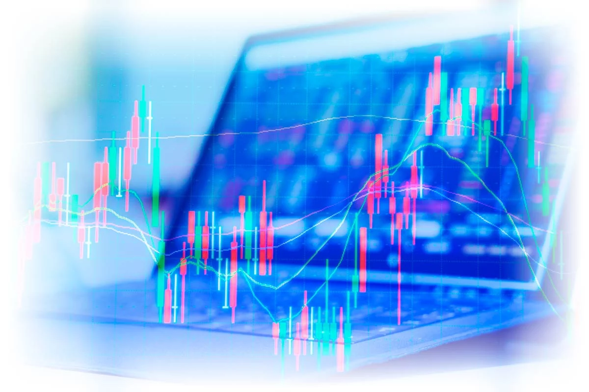 Laptop behind data chart showing volatility