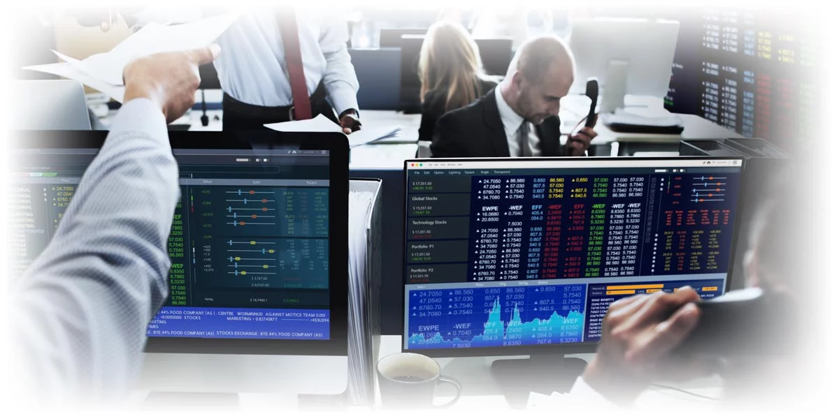 Wall Street brokers working at computers