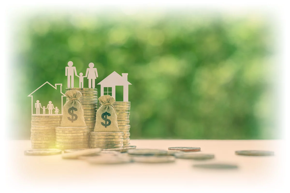Cutout-of-family-and-houses_1200px Cutout of family and houses and on top of stacks of coins