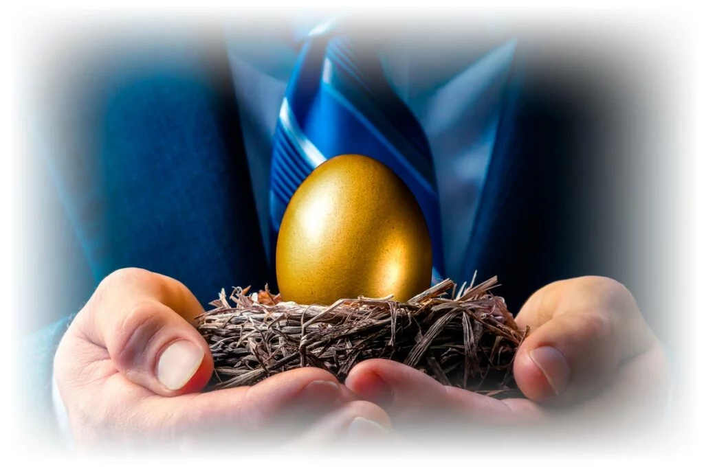 Man in suit holding golden nest egg