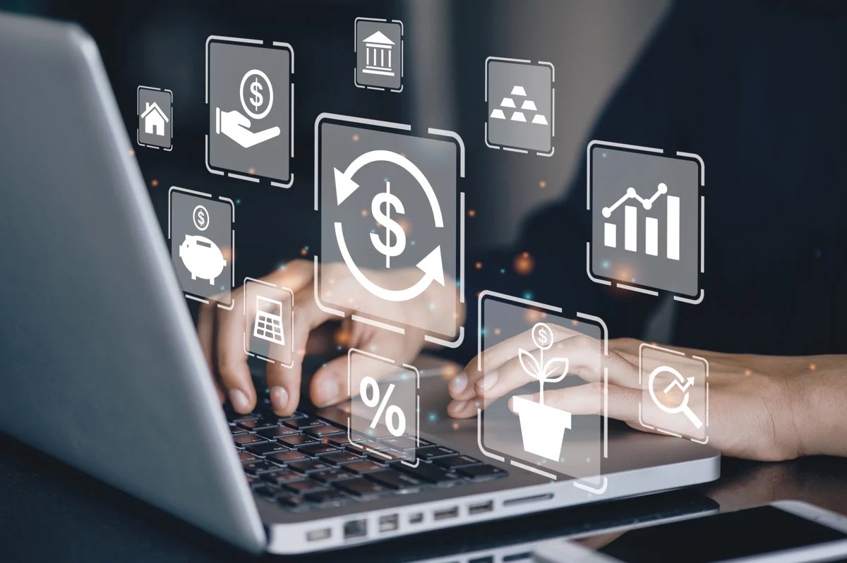 Hands at laptop with images representing different financial topics