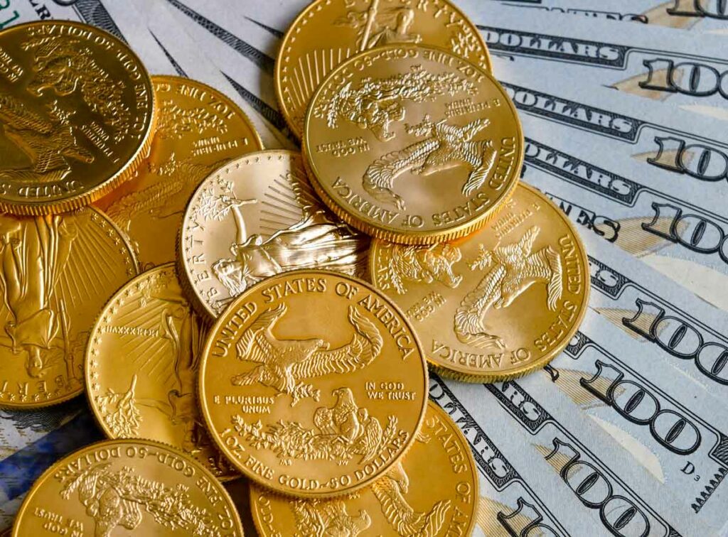 Gold American Eagle coins over $100 notes