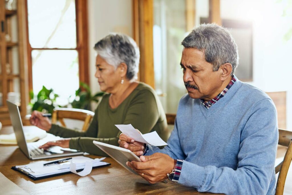 Older couple creating budget