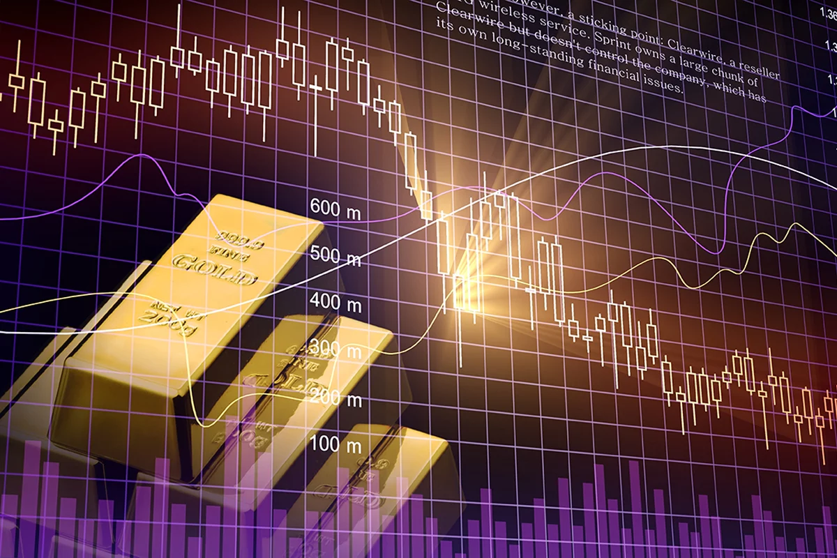 Gold ingots over black background with a financial chart