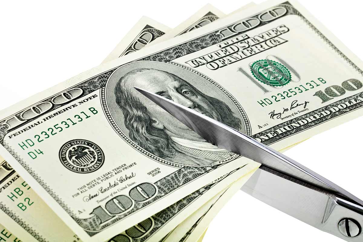 Dollars-cut-by-scissors_1200px
