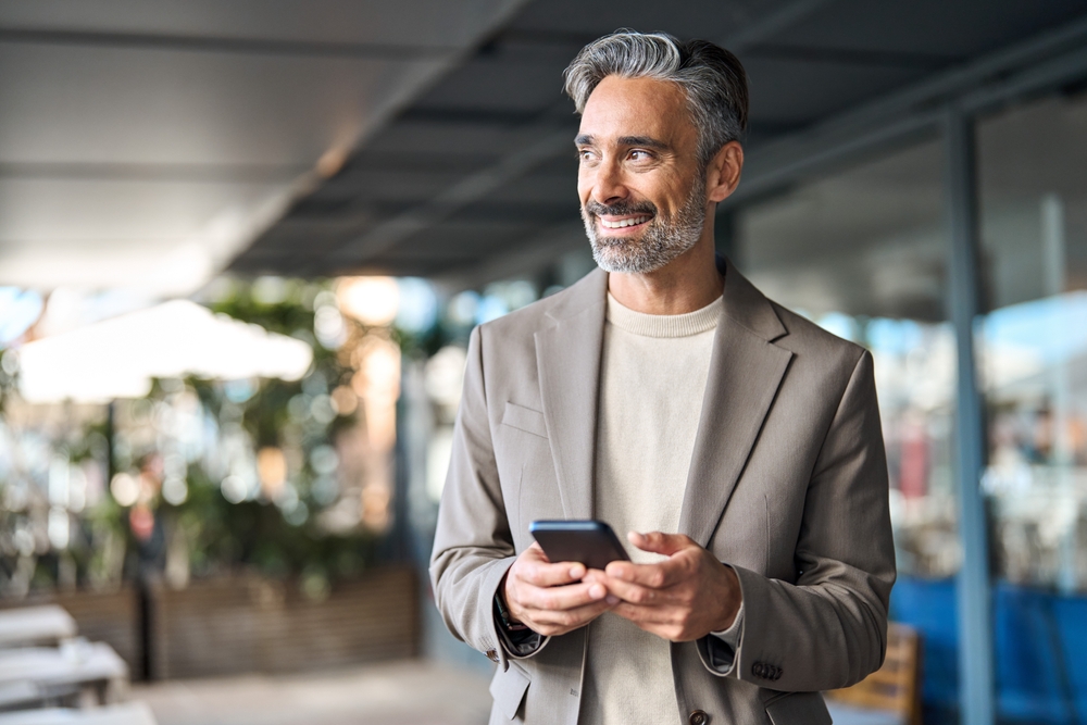 Man checking gold prices on phone