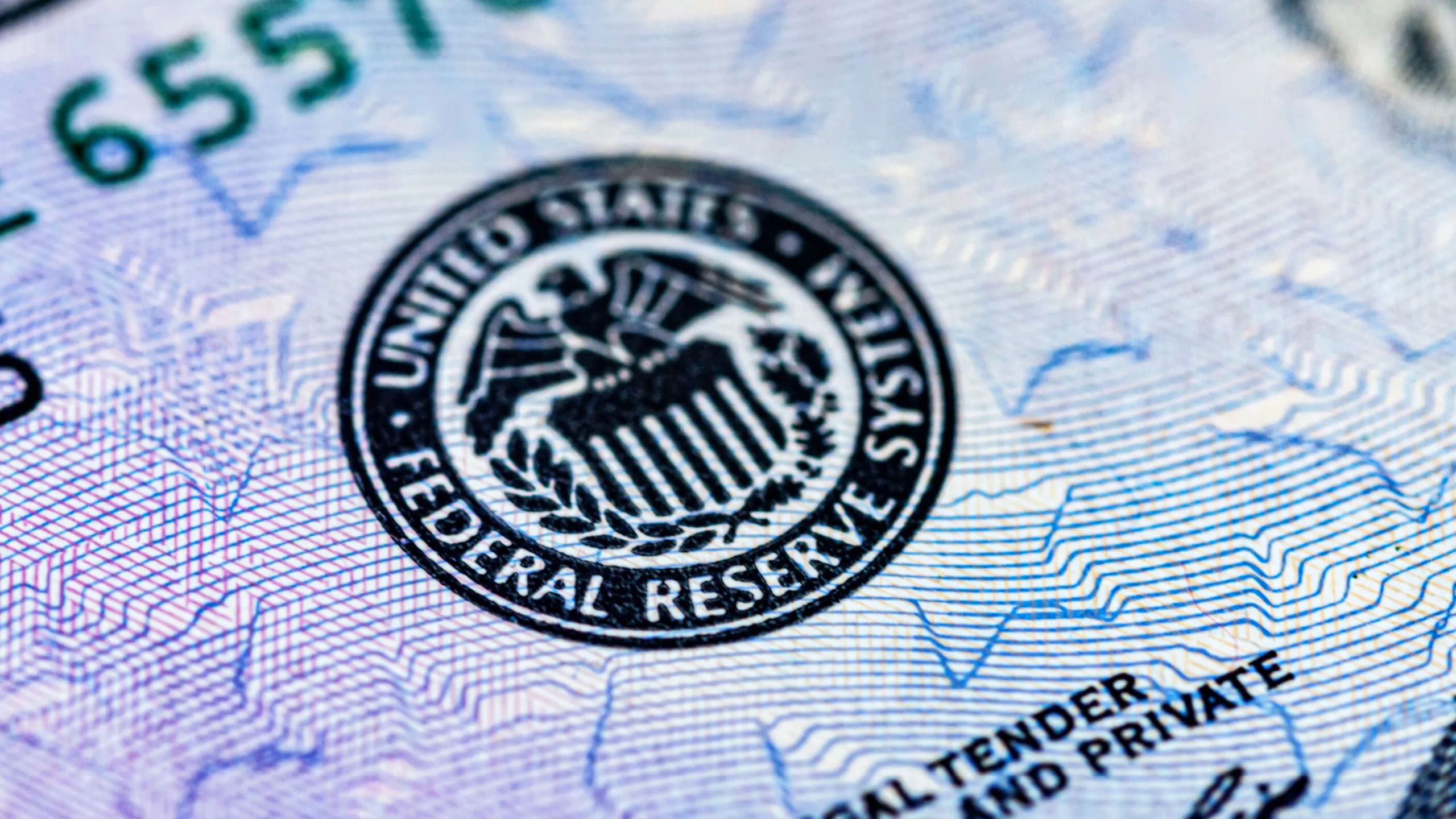 Federal Reserve seal on dollar.