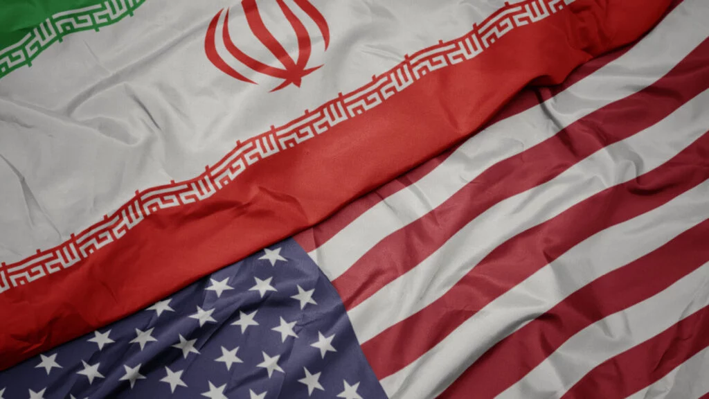 Overlapping Iran and United States flags