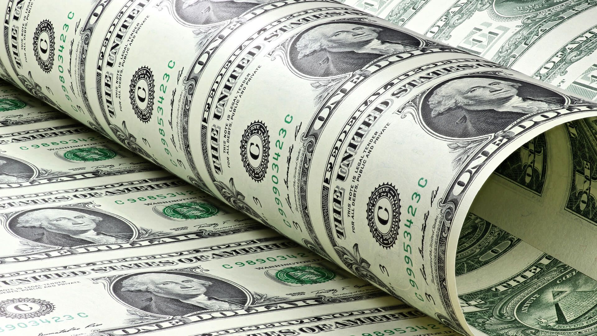 Close-up of rolled uncut sheet of US dollar bills
